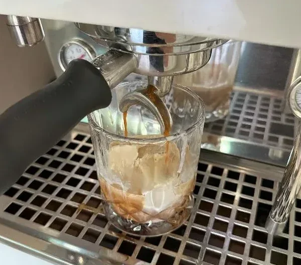 Pouring coffee on ice cream for an affogato